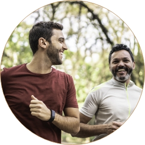 Men jogging in wooded setting