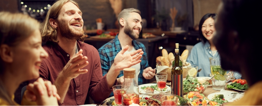 Friends having dinner and laughing