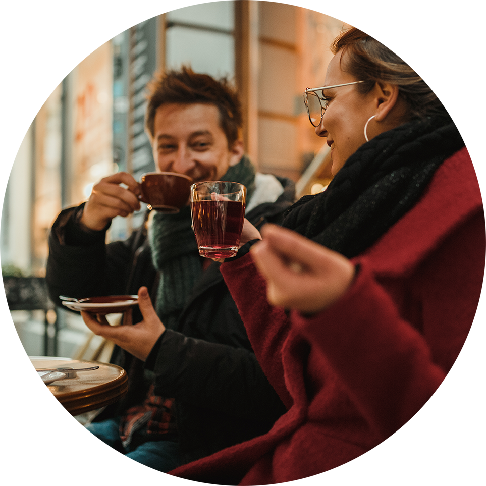 Couple sitting outside drinking tea