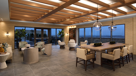 The Milton at Twinbrook Quarter rooftop clubroom with dining table and conversational seating