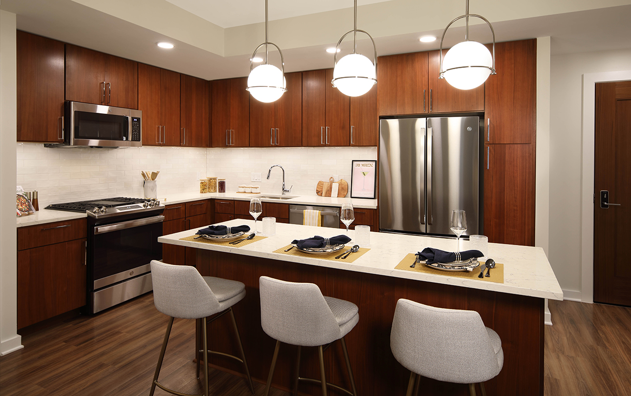 The Milton at Twinbrook Quarter two bedroom kitchen with dark cabinets and center island