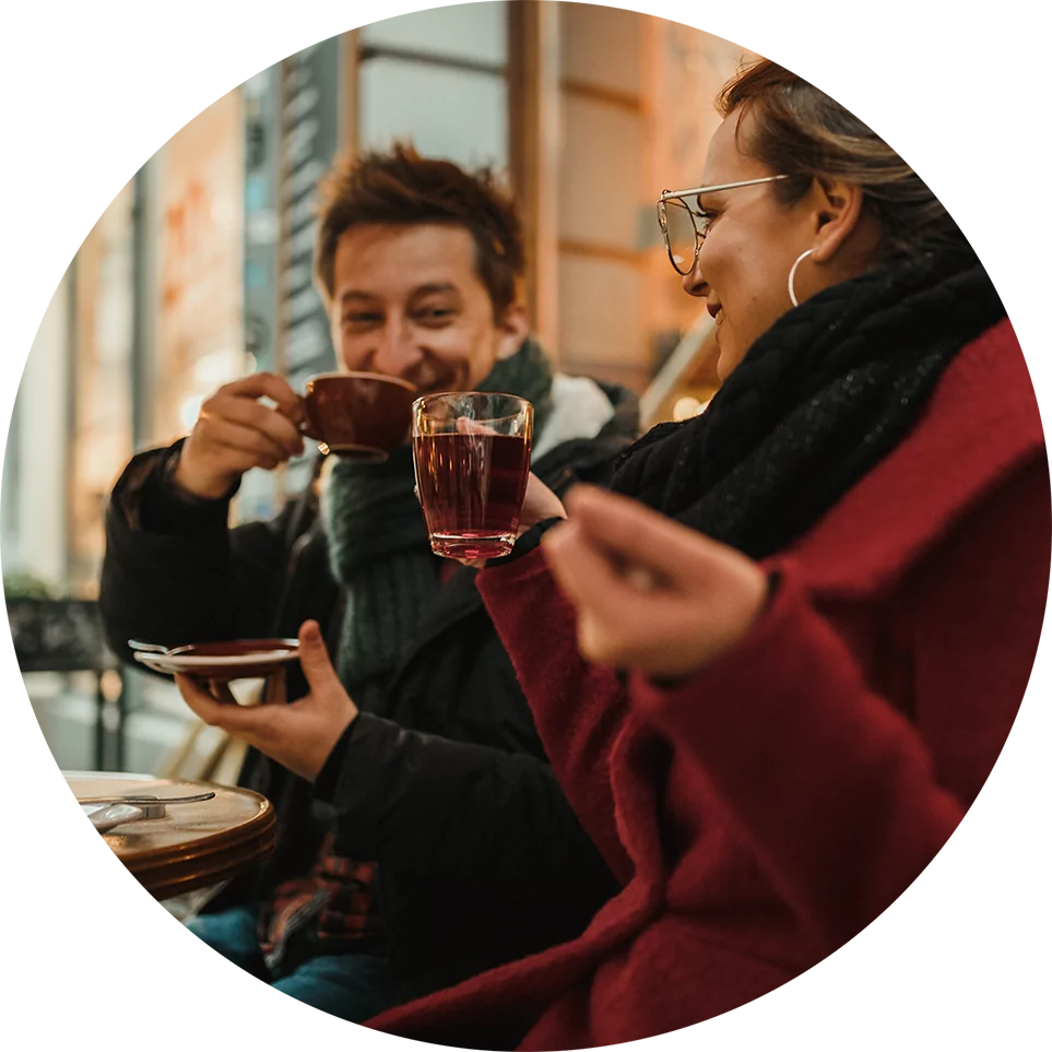 Couple sitting outside drinking tea